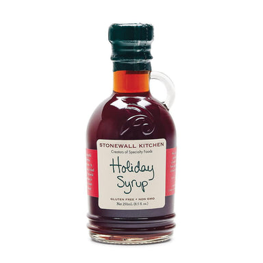 Bottle of Stonewall Kitchen Holiday Syrup on a white background