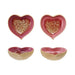 Set of four heart-shaped ceramic bowls with a pink and gold interior on a white background