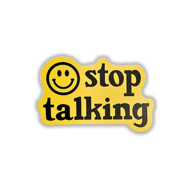 A yellow die-cut sticker with the words 'stop talking' in black lowercase letters and a black smiley face icon, shown on a plain white background.