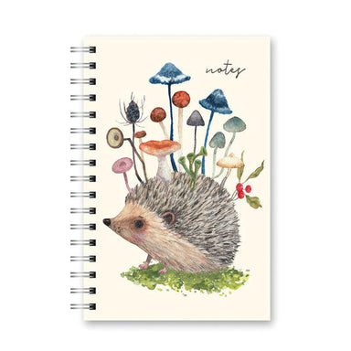 Notebook with a hedgehog and mushrooms illustration on a white background