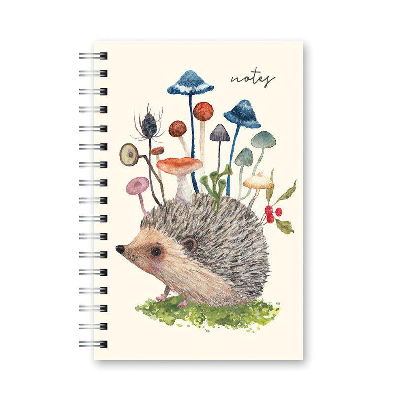 Notebook with a hedgehog and mushrooms illustration on a white background