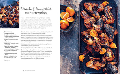 Grilled chicken wings with oranges on a platter, accompanied by a recipe text.