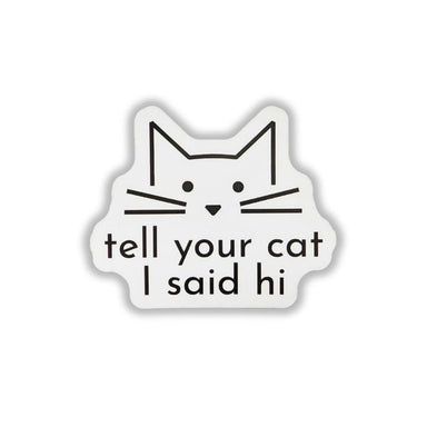 A die-cut white sticker featuring a minimalist black line drawing of a cat's face above the text 'tell your cat I said hi' in black lowercase letters, shown on a plain white background.
