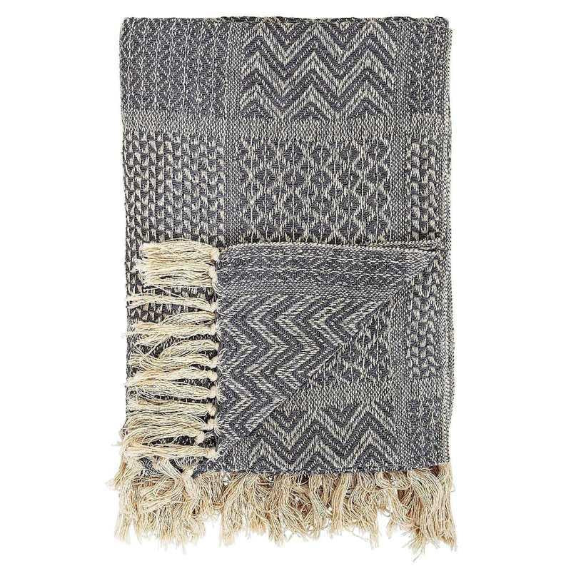 Textured blanket with geometric pattern and fringes on a white background
