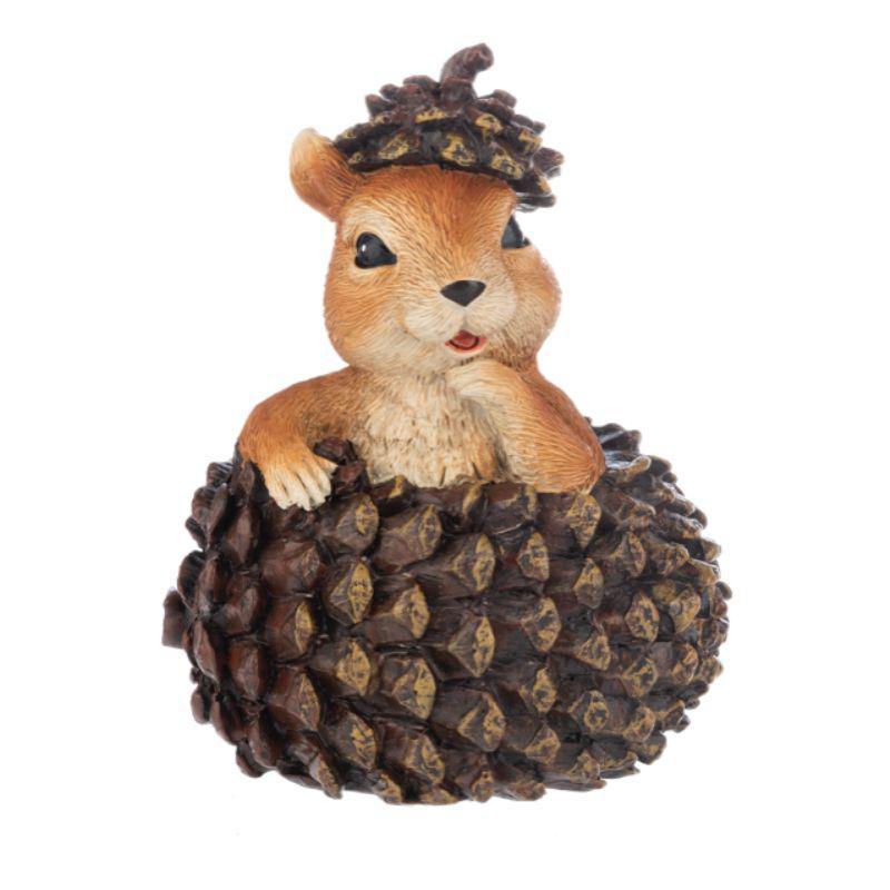 Hedgehog figurine on a pine cone with a white background