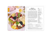 Platter of assorted cheeses, fruits, and crackers with a recipe card on a white background