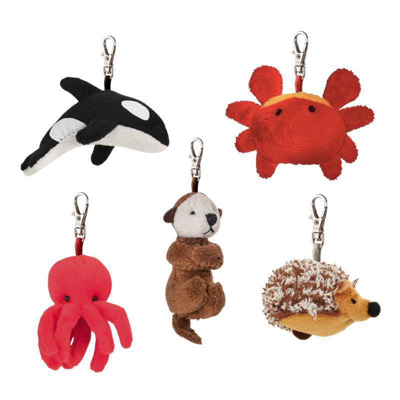 Set of five plush keychains shaped like an orca, crab, octopus, otter, and hedgehog on a white background.