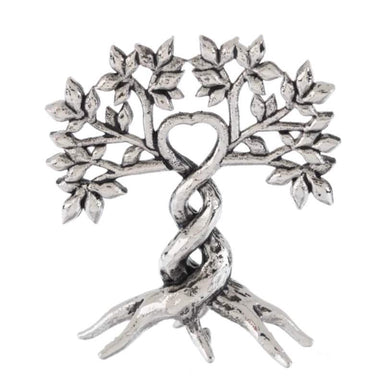 Silver tree-shaped brooch with a heart in the center on a white background