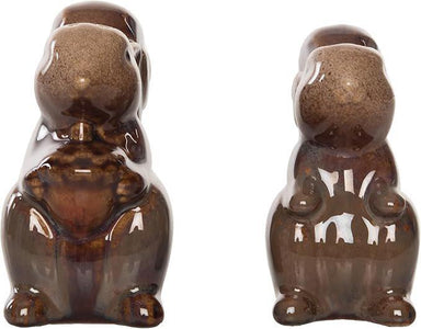 Two brown ceramic bear figurines on a white background
