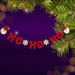 Christmas-themed banner with 'HO HO HO' text, snowflakes, and Santa Claus decorations on a purple background.