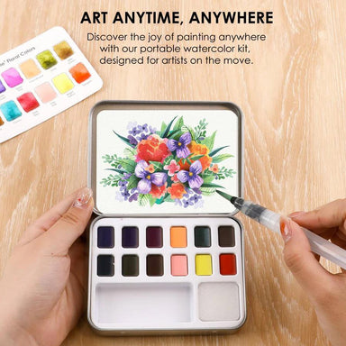 Portable watercolor kit with a floral painting on a wooden surface