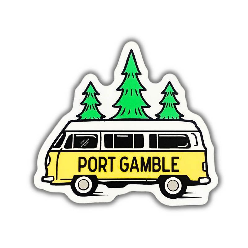 A die-cut sticker featuring a retro yellow and white van with the words 'PORT GAMBLE' in black, topped with three green pine trees, shown on a plain white background.