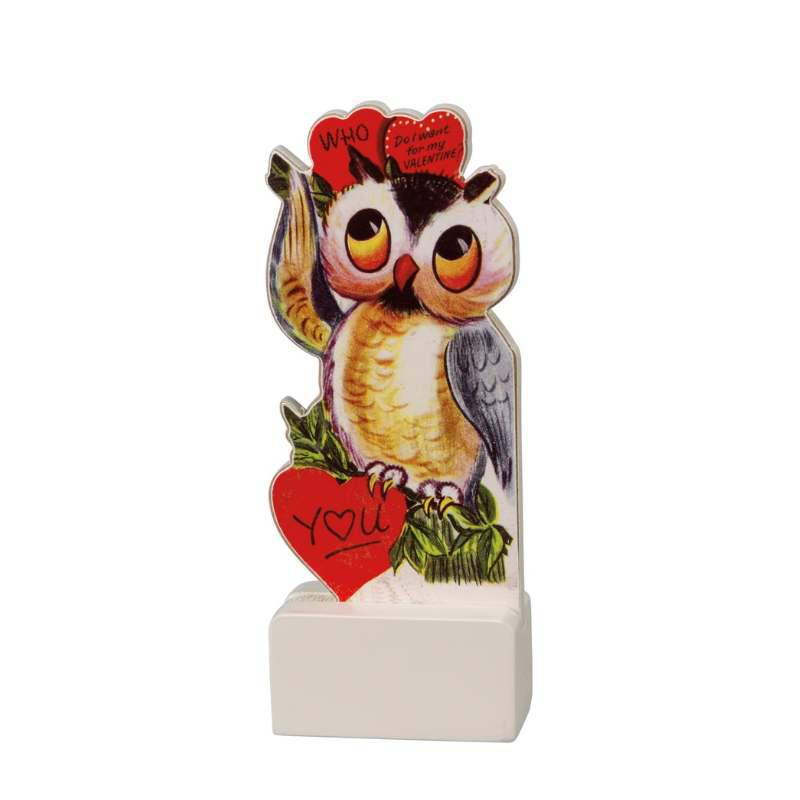 Decorative owl figurine with heart-shaped 'I love you' sign on a white background