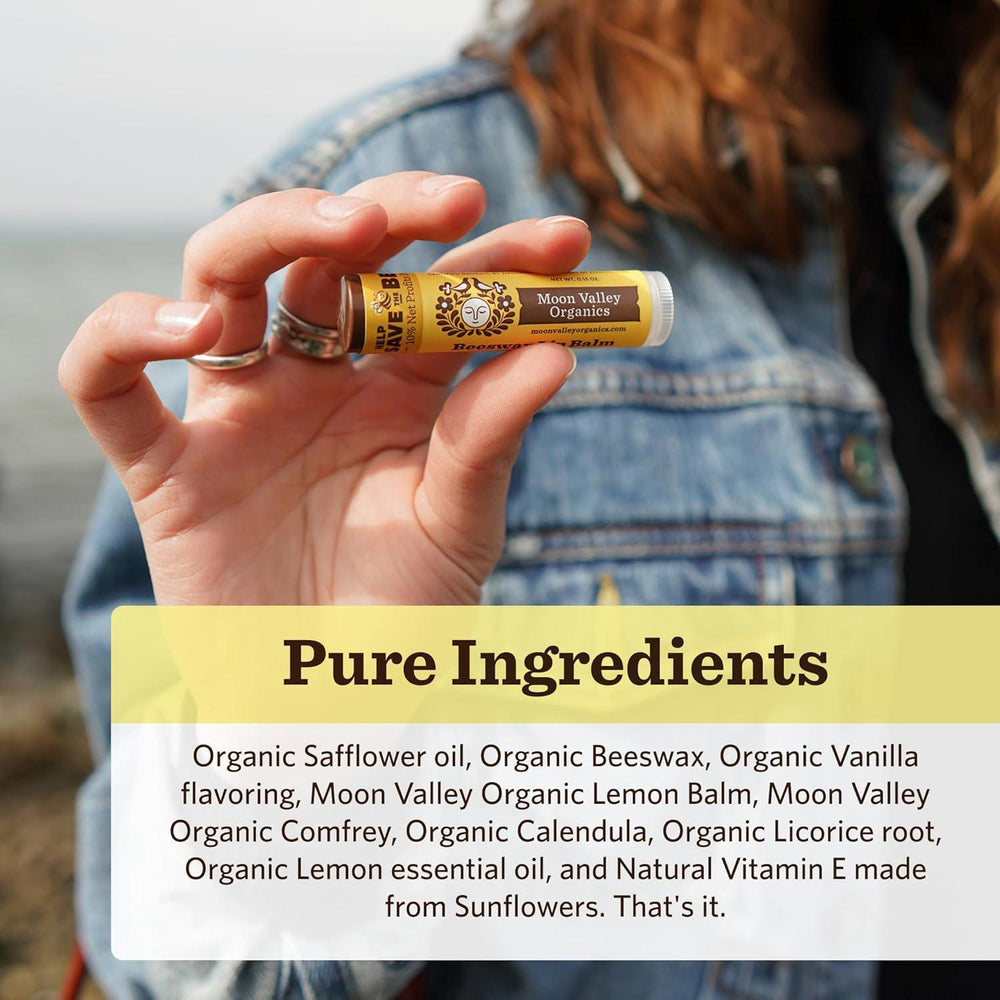 Hand holding a tube of Moon Valley Organics product with a focus on pure ingredients.