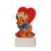 Vintage-style dog figurine with a heart and 'Be Mine' text on a white background