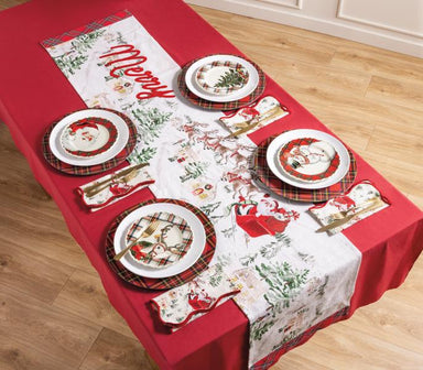 Christmas-themed table setting with red tablecloth, white placemats, and Santa Claus plates.