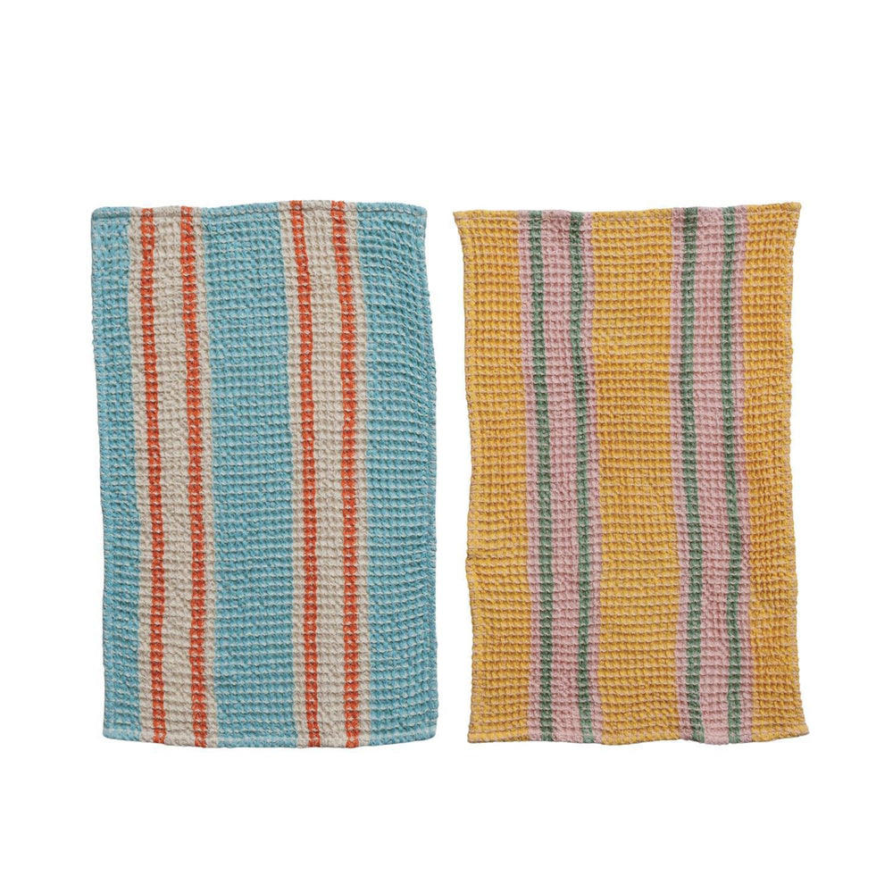 Two striped fabric towels, one blue and orange, the other yellow and pink, on a white background.
