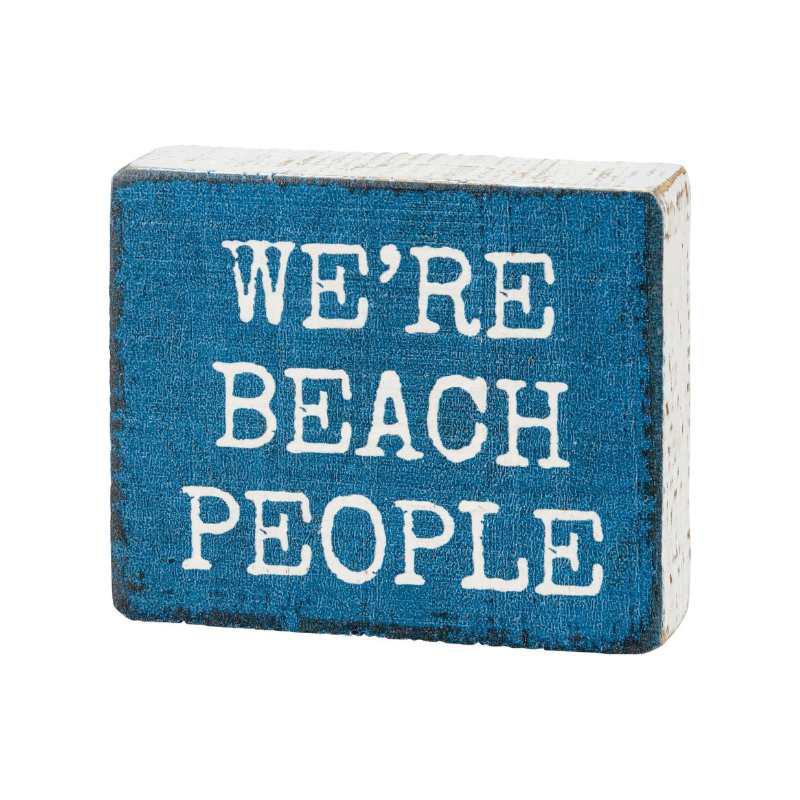 Blue block with white text 'WE'RE BEACH PEOPLE' on a white background