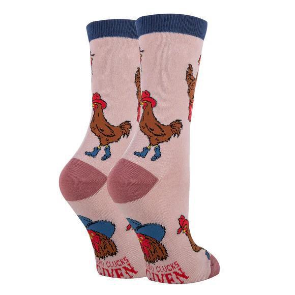 Pair of socks with rooster designs on a light pink background