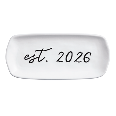 White dish with 'est. 2026' text on a white background