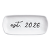 White dish with 'est. 2026' text on a white background