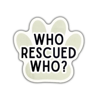 A paw-shaped sticker or decal with the text 'WHO RESCUED WHO?' in bold black letters on a pale sage green background with a white border, shown on a plain white background.