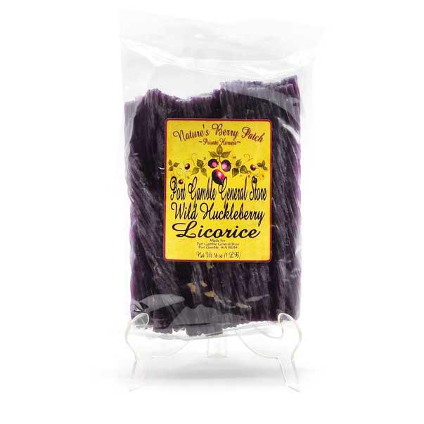 A clear plastic bag of Nature's Berry Patch Licorice root sticks with a yellow label, displayed on a small clear stand against a white background.
