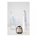 Hedgehog-shaped toothbrush holder with two toothbrushes on a white background