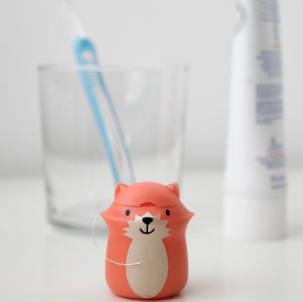 Cute animal-shaped bottle cap with a straw on a white background