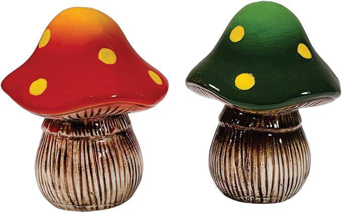 Two ceramic mushrooms with colorful caps on a white background