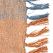 Textured fabric with blue and orange tassels on a white background