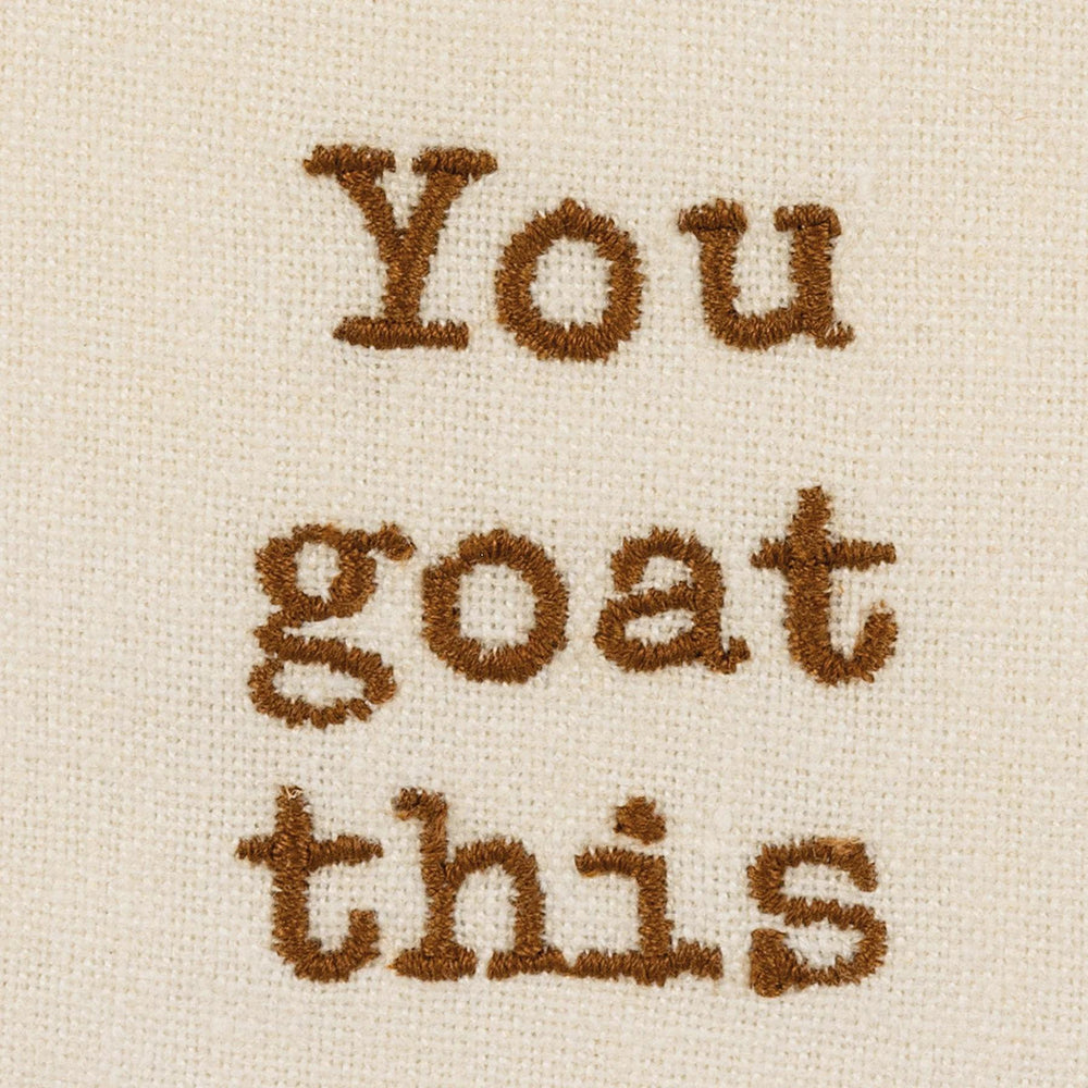 Text 'You goat this' embroidered in brown on beige fabric