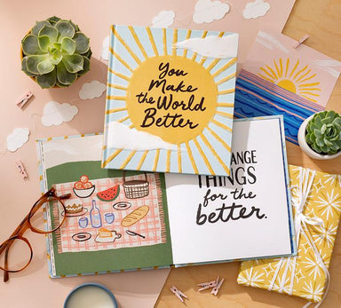 Set of greeting cards with motivational messages on a table with decorative items.