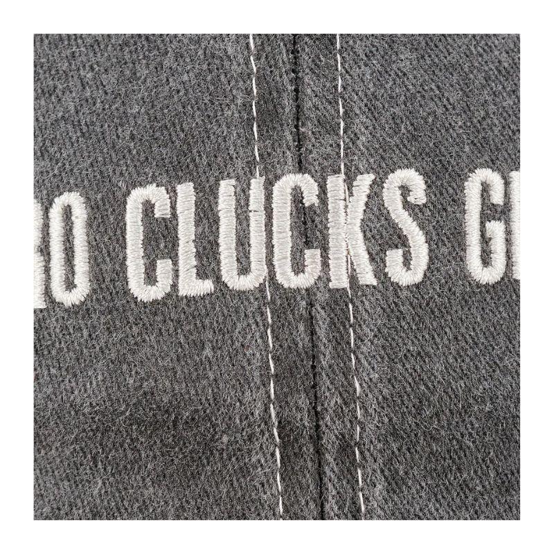 Gray fabric with white embroidered text 'NO CLUCKS GIVEN'.