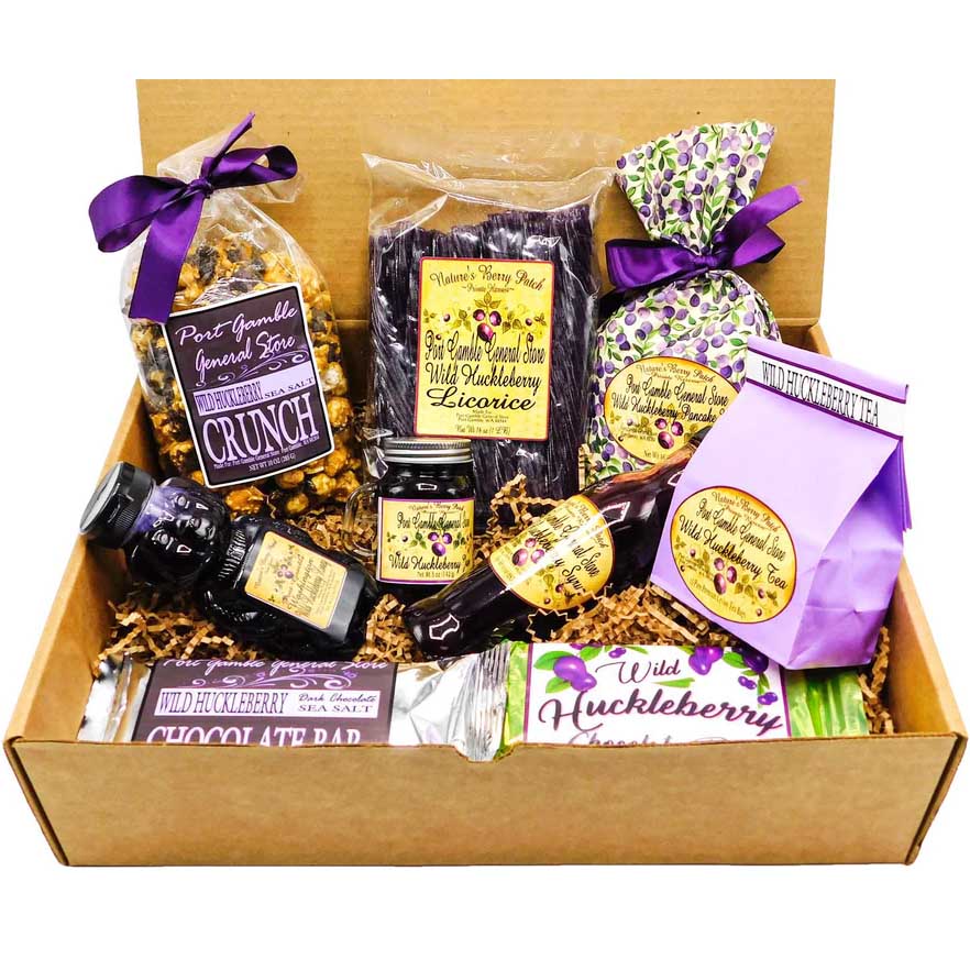 A huckleberry  lover gift set that includes: Delicious huckleberry chocolate sea salt bar, Wild Huckleberry Chocolate Bar, Sweet huckleberry popcorn crunch, Huckleberry licorice, Huckleberry jam, Huckleberry honey, Huckleberry tea, Huckleberry pancake mix and Wild Huckleberry Syrup.