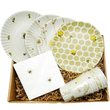 bee-themed patio party gift set containing a set of 4 melamine solo cups with 4 different designs with matching Set of 4 melamine Plates and a set of napkins with the print of 3 bees.