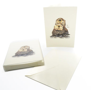 cards featuring a design of two adorable sea otters