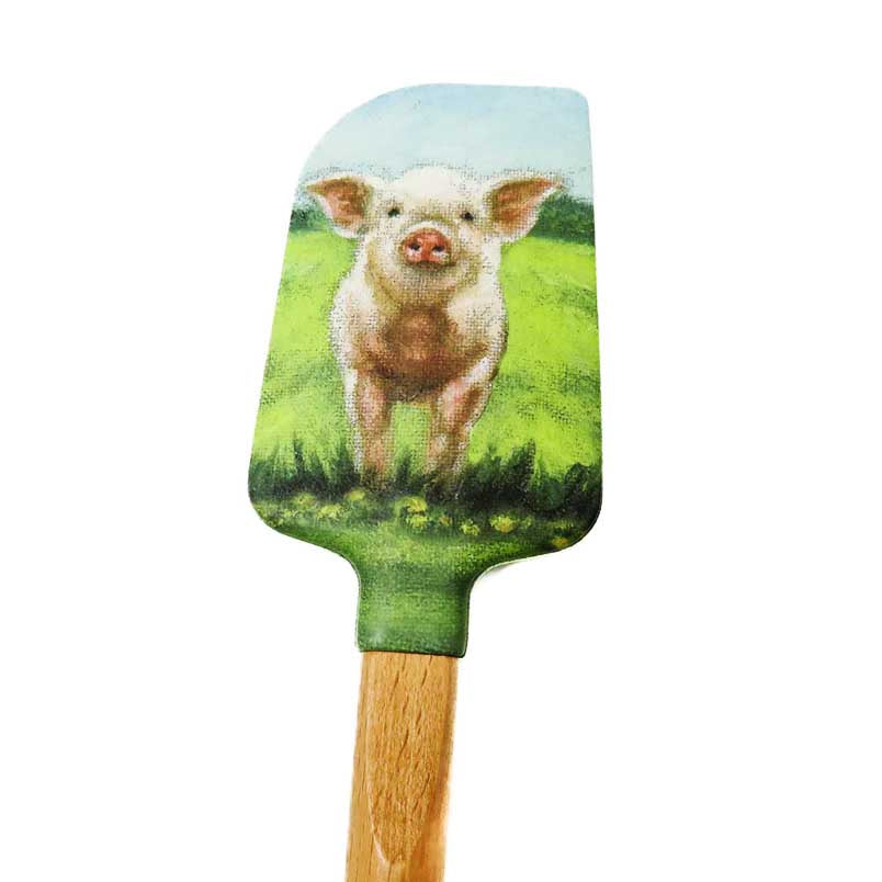kitchen spatula with a cute pig on a field print on the silicone head.