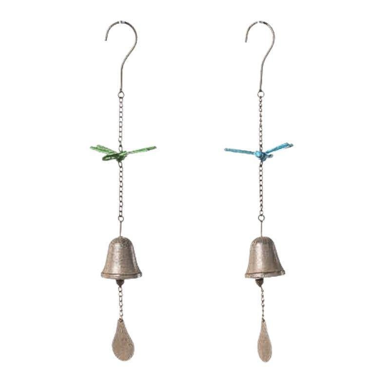 Two hanging bell decorations with dragonfly charms on a white background