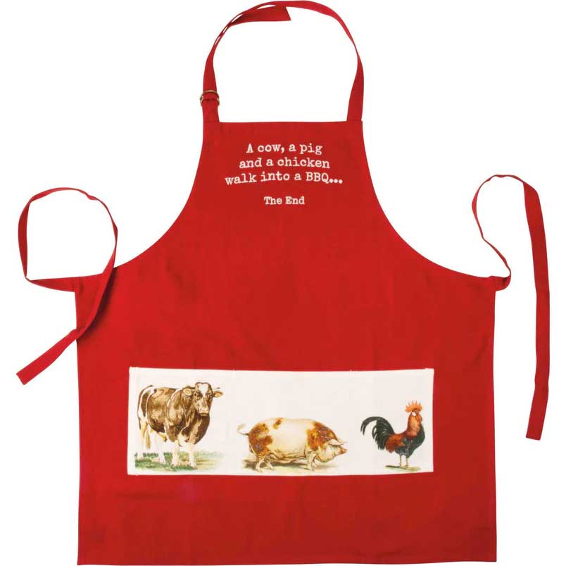 red apron with a bag showing the illustrations of a cow a pig and a chicken and a line that reads: "A cow, a pig and a chicken walk into a BBQ... The End" 