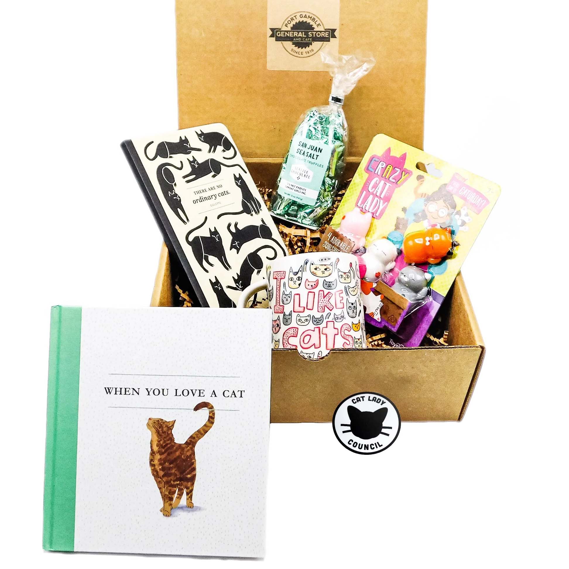 This gift box is filled with cat-themed goodies, including a bag of premium chocolate truffles, a mug, a journal and the book "When You Love a Cat” and cat squishies.