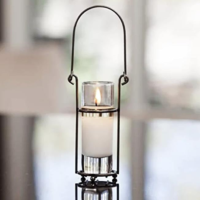 metal candle holder with white votive scented candle light 