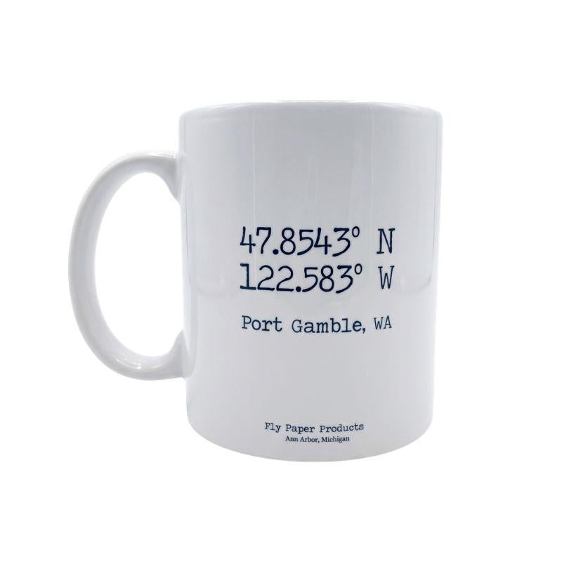 White mug with coordinates and text on a white background