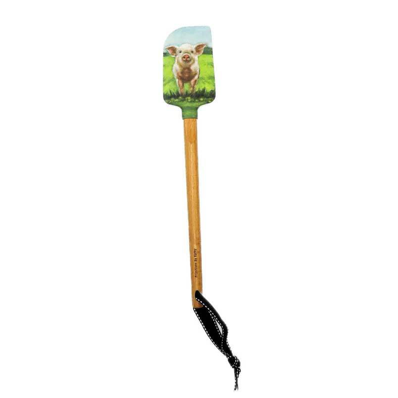 kitchen spatula with a cute pig on a field print on the silicone head and a wooden handle.