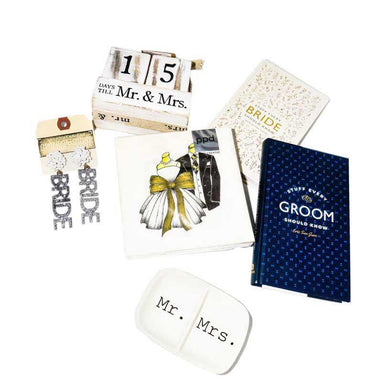 photo that shows the collection of things that include a countdown to Mr & Mrs calendar Block, a Mr & Mrs Ring Dish, themed Napkins, "Stuff Every Bride Should Know" book, "Stuff Every Groom Should Know" book and a pair of Bride Earrings