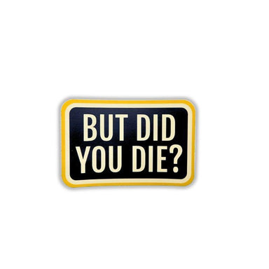 Black sign with yellow border and white text 'BUT DID YOU DIE?' on a white background