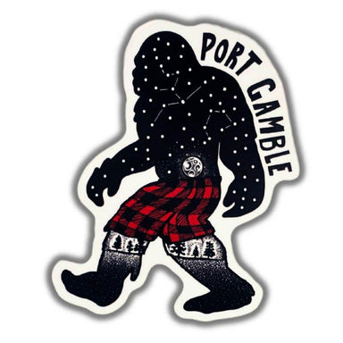 A die-cut sticker featuring a stylized Bigfoot figure in black with white constellation dots, a red and black plaid kilt, and the words 'PORT GAMBLE' curved along the top right, shown on a plain white background.
