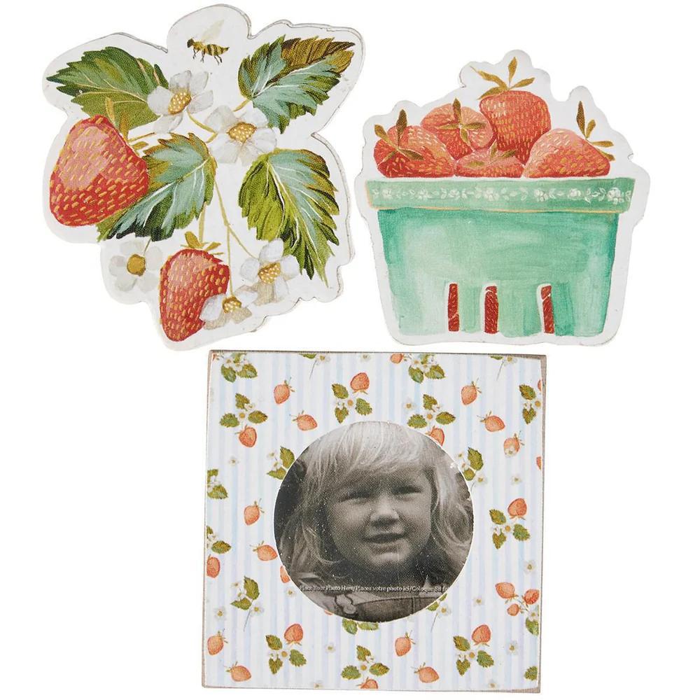 Set of three decorative items with strawberry designs on a white background