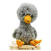 toy duck from finding muchness book a cute grey plushie duck with yellow beak and feet.