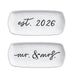Two white ceramic plates with text 'est. 2026' and 'mr. & mrs.' on a white background.